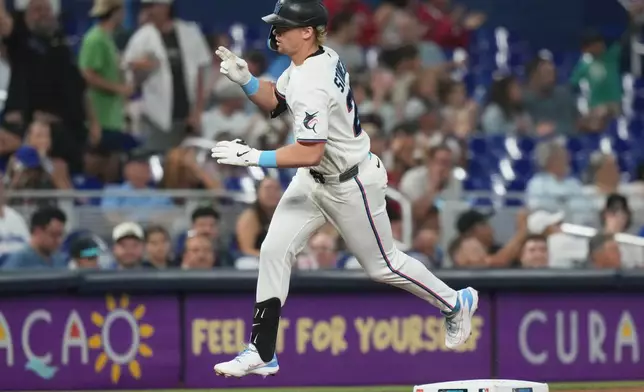 Miami Marlins' Kyle Stowers rounds third base after hitting a solo home run during the fourth inning of a baseball game Atlanta Braves, Thursday, May 21, 2026, in Miami. (AP Photo/Lynne Sladky)