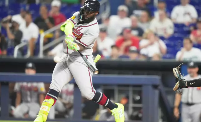 Atlanta Braves' Michael Harris II hits a two run home run during the first inning of a baseball game against the Miami Marlins, Thursday, May 21, 2026, in Miami. (AP Photo/Lynne Sladky)