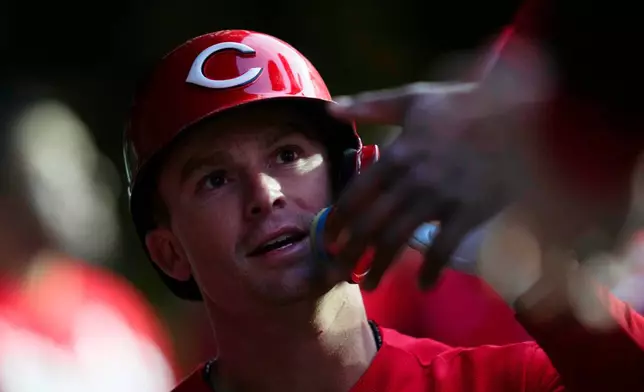 Cincinnati Reds' Matt McLain (9) celebrates after hitting a home run during the fifth nning of a baseball game against the Cincinnati Reds, Wednesday, May 6, 2026, in Chicago. (AP Photo/Erin Hooley)
