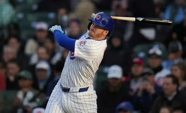 Chicago Cubs' Ian Happ hits a two-run home run during the first inning of a baseball game against the Cincinnati Reds, Wednesday, May 6, 2026, in Chicago. (AP Photo/Erin Hooley)