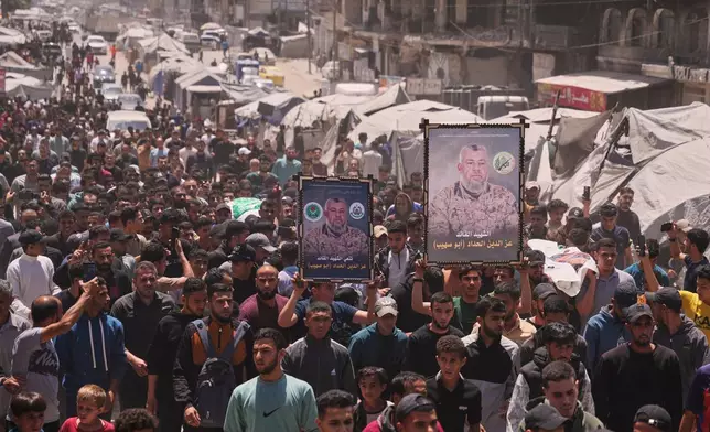 Palestinians attend the funeral of Izz al-Din al-Haddad, the leader of Hamas' Qassam Brigades, and his daughter and wife in Gaza City, Saturday, May 16, 2026. They were killed in an Israeli strike Friday evening. (AP Photo/Abdel Kareem Hana)