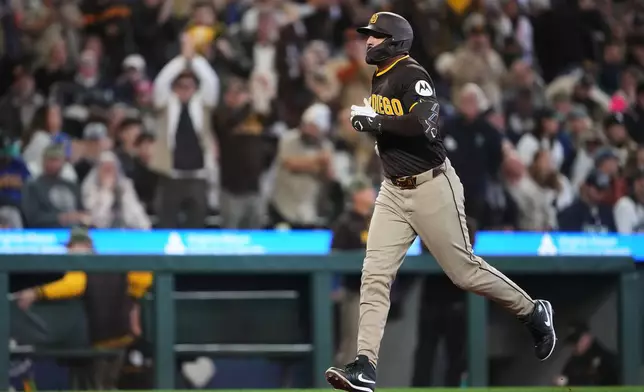 San Diego Padres' Nick Castellanos jogs home after hitting a three-run home run against the Seattle Mariners during the fourth inning of a baseball game, Saturday, May 16, 2026, in Seattle. (AP Photo/Lindsey Wasson)