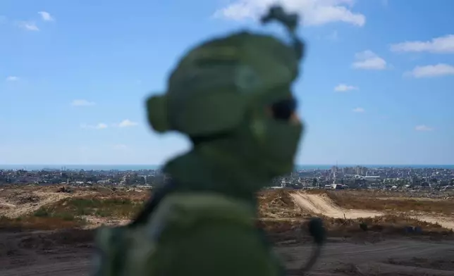 An Israeli soldier occupies a military position overlooking the so-called yellow line in the central Gaza Strip, Tuesday, May 26, 2026. (AP Photo/Ariel Schalit)