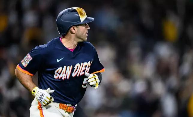 San Diego Padres' Ramón Laureano watches his home run during the seventh inning of a baseball game against the Athletics, Friday, May 22, 2026, in San Diego. (AP Photo/William Liang)