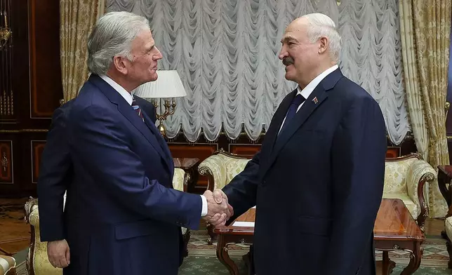 In this photo released by Belarusian presidential press service, Belarusian President Alexander Lukashenko, right, and U.S. evangelist Franklin Graham shake hands during their meeting in Minsk, Belarus, Friday, May 15, 2026. (Belarusian Presidential Press Service via AP)