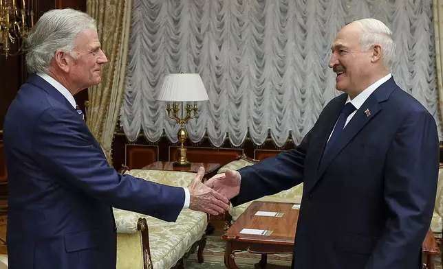 In this photo released by Belarusian presidential press service, Belarusian President Alexander Lukashenko, right, and U.S. evangelist Franklin Graham shake hands during their meeting in Minsk, Belarus, Friday, May 15, 2026. (Belarusian Presidential Press Service via AP)