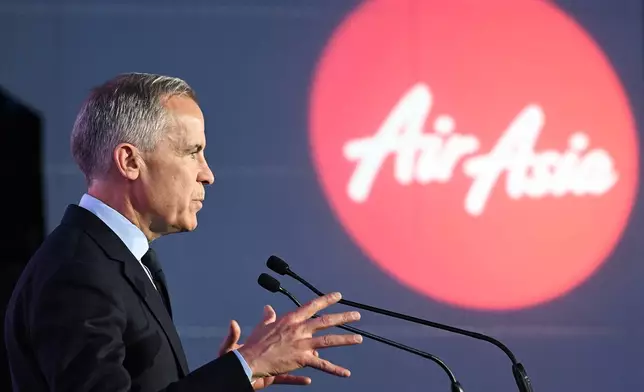 Canada's Prime Minister Mark Carney speaks during an event at the Airbus A220 Delivery Center in Mirabel, Que., Wednesday, May 6, 2026, where AirAsia placed a landmark order for 150 Airbus A220 aircraft. (Graham Hughes/The Canadian Press via AP)