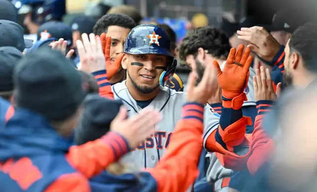 Houston Astros' Isaac Paredes celebrates in the dugout after hitting a two-run home run against the Minnesota Twins during the first inning of a baseball game Tuesday, May 19, 2026, in Minneapolis. (AP Photo/Craig Lassig)