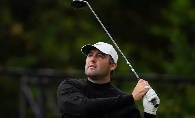 Scottie Scheffler hits from the 13th tee during the second round of the PGA Championship golf tournament at Aronimink Golf Club, Friday, May 15, 2026, in Newtown Square, PA. (AP Photo/Carolyn Kaster)