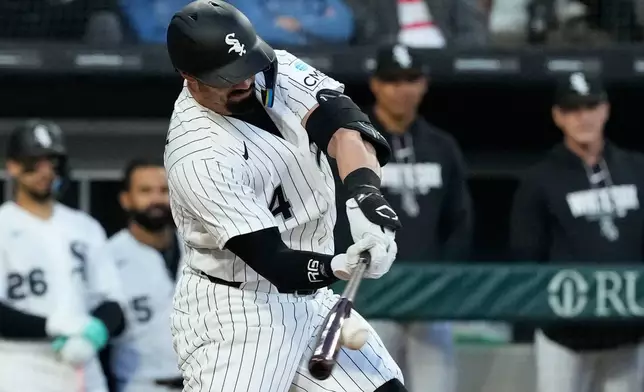 Chicago White Sox's Randal Grichuk hits a one-run single during the fifth inning of a baseball game against the Minnesota Twins in Chicago, Wednesday, May 27, 2026. (AP Photo/Nam Y. Huh)