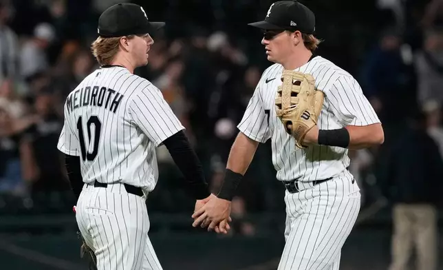 Chicago White Sox second baseman Chase Meidroth, left, celebrates with left fielder Sam Antonacci after the White Sox defeated the Minnesota Twins in a baseball game in Chicago, Wednesday, May 27, 2026. (AP Photo/Nam Y. Huh)