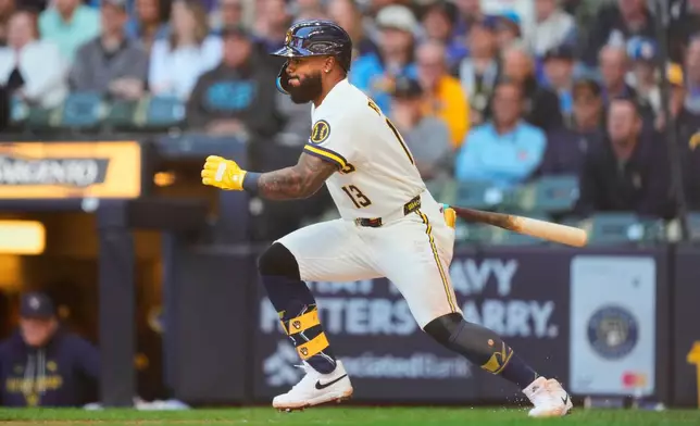 Milwaukee Brewers' Luis Rengifo hits a two-run RBI single during the first inning of a baseball game against the San Diego Padres, Thursday, May 14, 2026, in Milwaukee. (AP Photo/Kayla Wolf)