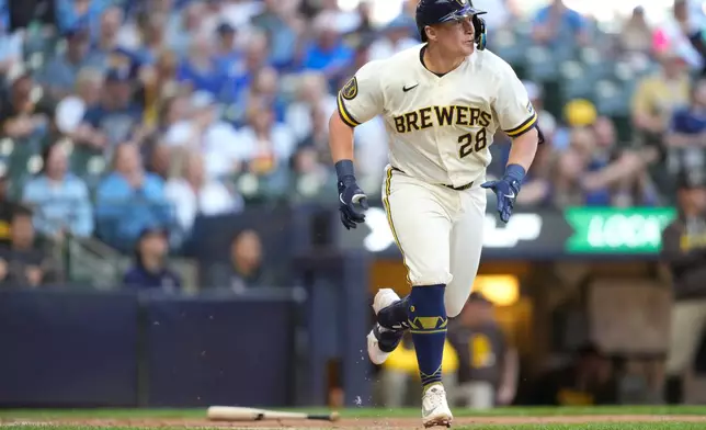 Milwaukee Brewers' Andrew Vaughn runs down the first base line after hitting a double during the fourth inning of a baseball game against the San Diego Padres, Thursday, May 14, 2026, in Milwaukee. (AP Photo/Kayla Wolf)