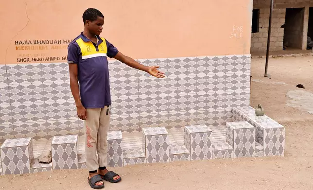 A student from an orphanage school that was abducted with others by gunmen in late April, is photographed following his released in Lokoja, Nigeria, Thursday, May 7, 2026. (AP Photo/Haruna Yahaya)