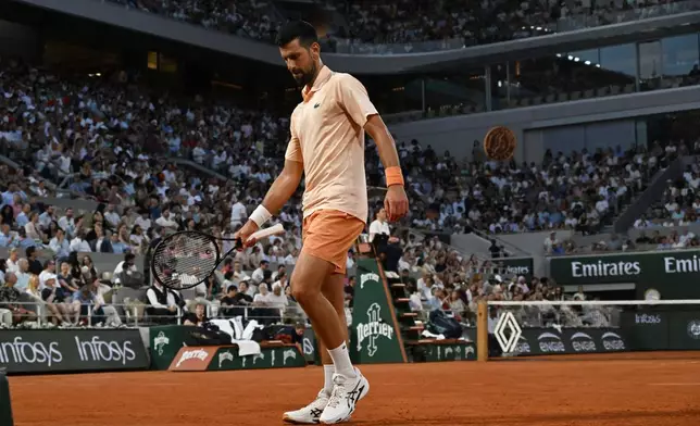 Novak Djokovic of Serbia walks as he plays against Giovanni Mpetshi Perricard of France during their first round men's singles tennis match at the French Open tennis tournament in Paris, Sunday, May 24, 2026. (AP Photo/Emma Da Silva)