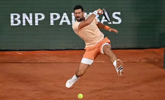 Novak Djokovic of Serbia returns to Giovanni Mpetshi Perricard of France during their first round men's singles tennis match at the French Open tennis tournament in Paris, Sunday, May 24, 2026. (AP Photo/Emma Da Silva)