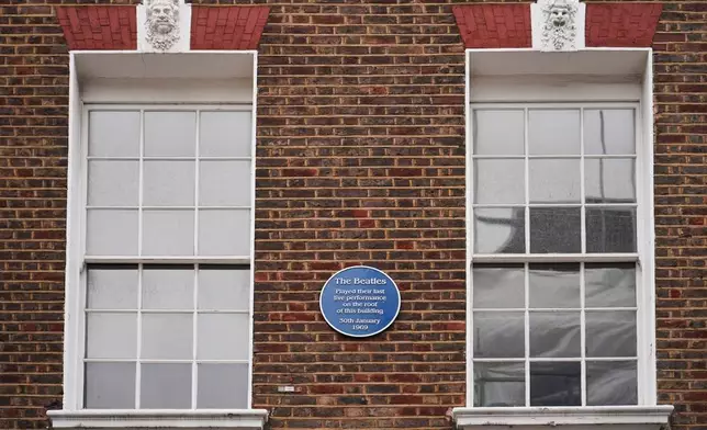 A view of the blue plaque on the building in Savile Row where The Beatles held their last ever concert as a band, which is due to be turned into a fan museum in 2027, in London, Sunday, May 10, 2026. (AP Photo/Alberto Pezzali)