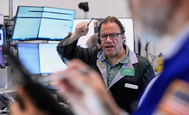 Options trader Anthony Spina works on the floor of the New York Stock Exchange, Friday, May 22, 2026. (AP Photo/Richard Drew)