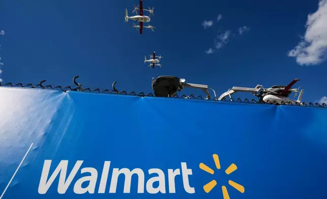 Drones operated by Zipline leave base to make deliveries from a Walmart store in Pea Ridge, Ark., Friday, Sept. 26, 2025. (AP Photo/Charlie Riedel)