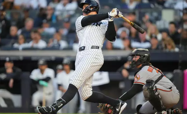 New York Yankees' Aaron Judge hits a two-run home run during the first inning of a baseball game against Baltimore Orioles, Monday, May 4, 2026, in New York. (AP Photo/Yuki Iwamura)