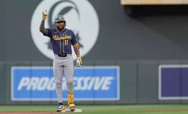 Milwaukee Brewers' Jackson Chourio celebrates after hitting a double during the eighth inning of a baseball game against the Minnesota Twins, Saturday, May 16, 2026, in Minneapolis. (AP Photo/Bailey Hillesheim)