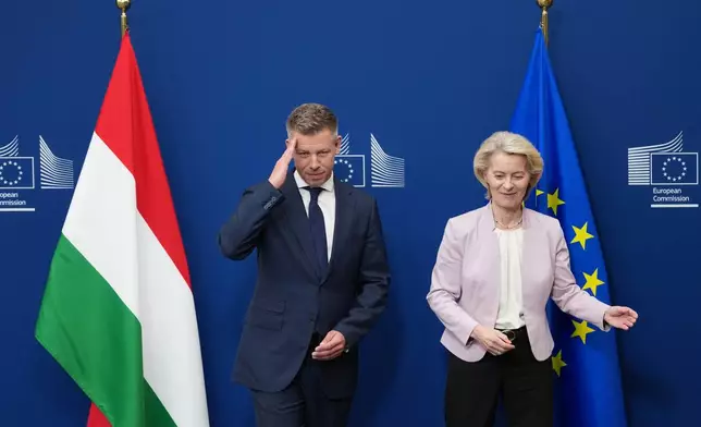 European Commission President Ursula von der Leyen, right, greets Hungary's Prime Minister Peter Magyar prior to a meeting at EU headquarters in Brussels, Friday, May 29, 2026. (AP Photo/Virginia Mayo)