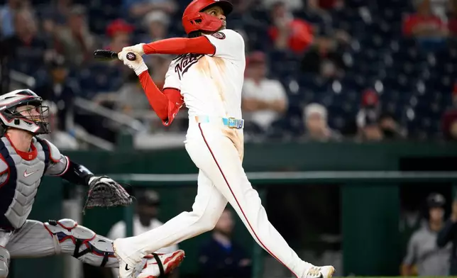 Washington Nationals' CJ Abrams follows through on his grand slam during the eighth inning of a baseball game against the Minnesota Twins, Wednesday, May 6, 2026, in Washington. (AP Photo/Nick Wass)