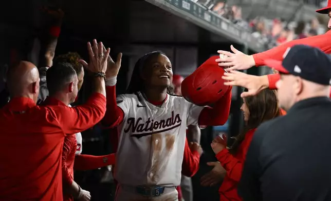 Washington Nationals' CJ Abrams celebrates his grand slam during the eighth inning of a baseball game against the Minnesota Twins, Wednesday, May 6, 2026, in Washington. (AP Photo/Nick Wass)
