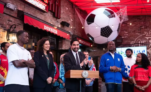 New York City Mayor Zohran Mamdani, center, joined by, from left, United States soccer star Tim Weah NYC World Cup Czar Maya Handa, and New York council member Yusef Salaam, makes a World Cup soccer tournament announcement at Harlem Tavern, Thursday, May 21, 2026 in New York. (AP Photo/Adam Gray)