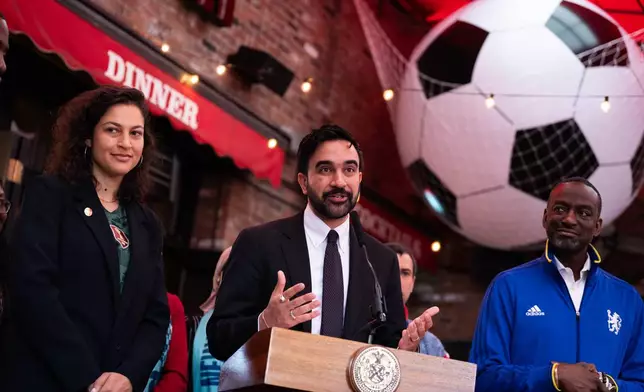 New York Mayor Zohran Mamdani, alongside NYC World Cup Czar Maya Handa, NYC World Cup Czar, left, and New York council member Yusef Salaam, makes a World Cup soccer tournament announcement at Harlem Tavern, Thursday, May 21, 2026 in New York. (AP Photo/Adam Gray)
