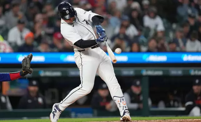 Detroit Tigers' Spencer Torkelson hits a two-run home run against the Texas Rangers during the fifth inning of a baseball game Sunday, May 3, 2026, in Detroit. (AP Photo/Paul Sancya)