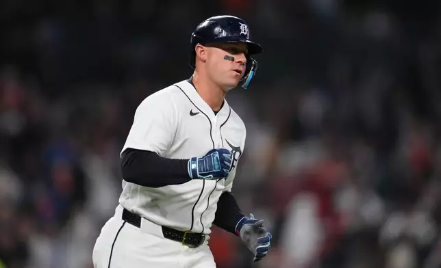 Detroit Tigers' Spencer Torkelson pumps his fist after hitting a two-run home run against the Texas Rangers during the fifth inning of a baseball game Sunday, May 3, 2026, in Detroit. (AP Photo/Paul Sancya)