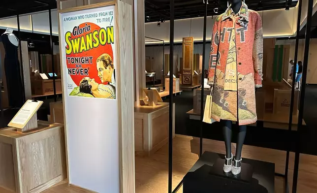 A Chanel coat and midi skirt inspired by the poster for the 1931 film "Tonight or Never" is pictured on display as part of the Comite Colbert "Hidden Treasures" exhibit at The Shed on Tuesday, May 26, 2026, in New York. (AP Photo/Beatrice Dupuy)