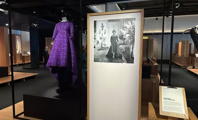 A violet evening gown designed by Cristobal Balenciaga as worn by American socialite Mona von Bismarck is pictured on display as part of the Comite Colbert "Hidden Treasures" exhibit at The Shed on Tuesday, May 26, 2026, in New York. (AP Photo/Beatrice Dupuy)
