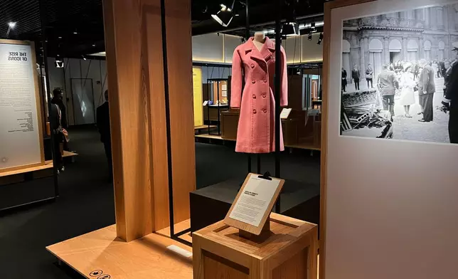 A pink wool Givenchy coat worn by former US first lady Jacqueline Kennedy Onassis is pictured on display as part of the Comite Colbert "Hidden Treasures" exhibit at The Shed on Tuesday, May 26, 2026, in New York. (AP Photo/Beatrice Dupuy)