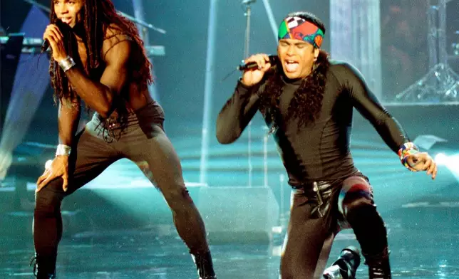 FILE - In this Oct. 26, 1992 file photo, Fabrice Morvan, left, and Rob Pilatus of Milli Vanilli perform during the taping of the Arsenio Hall Show in Los Angeles. (AP Photo/Craig Fujii, File)