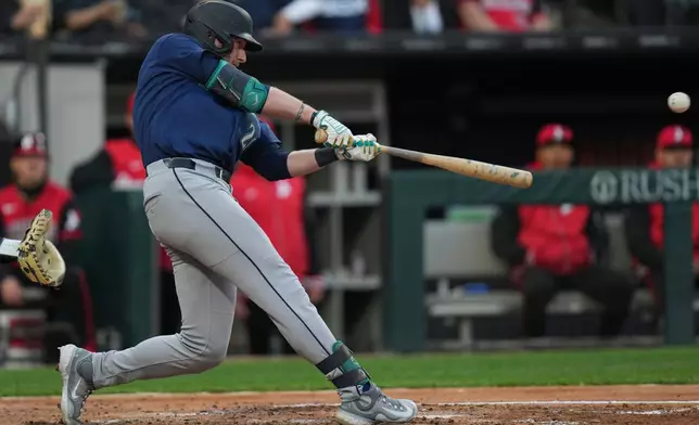 Seattle Mariners' Luke Raley hits a grand slam during the third inning of a baseball game against the Chicago White Sox, Friday, May 8, 2026, in Chicago. (AP Photo/Erin Hooley)
