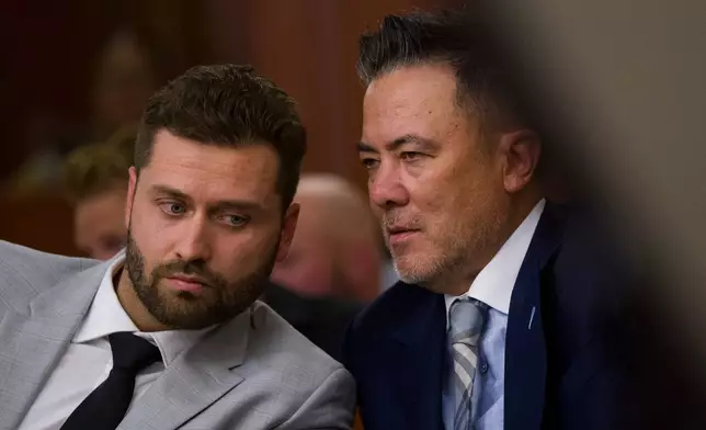 Dakota Mortensen, left, speaks with his attorney Joel Kittrell in Third District Court for a hearing regarding protective orders in Salt Lake City on Thursday, April 30, 2026. (Bethany Baker/The Salt Lake Tribune via AP, Pool)