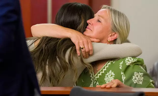 Taylor Frankie Paul, left, hugs Cheyenne Cranford Mortensen, Dakota Mortensen's mother, after appearing in Third District Court for a hearing regarding protective orders in Salt Lake City on Thursday, April 30, 2026. (Bethany Baker/The Salt Lake Tribune via AP, Pool)