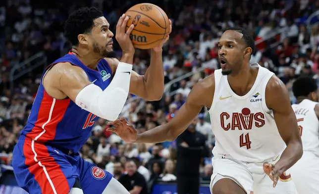 Detroit Pistons forward Tobias Harris, left, looks for a shot against Cleveland Cavaliers center Evan Mobley (4) during the first half of Game 7 in a second-round NBA basketball playoffs series, Sunday, May 17, 2026, in Detroit. (AP Photo/Duane Burleson)