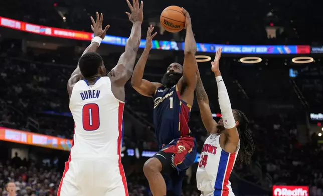 Cleveland Cavaliers' James Harden (1) shoots between Detroit Pistons' Jalen Duren (0) and Daniss Jenkins (24) in the second half of Game 6 of a second-round NBA basketball playoffs series Friday, May 15, 2026, in Cleveland. (AP Photo/Sue Ogrocki)
