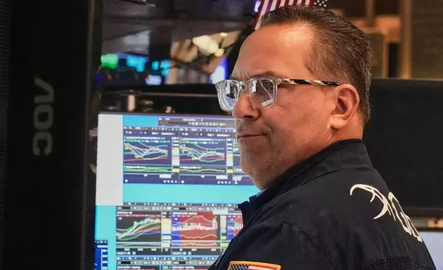 Specialist Anthony Matesic works at his post on the floor of the New York Stock Exchange, Thursday, April 30, 2026. (AP Photo/Richard Drew)