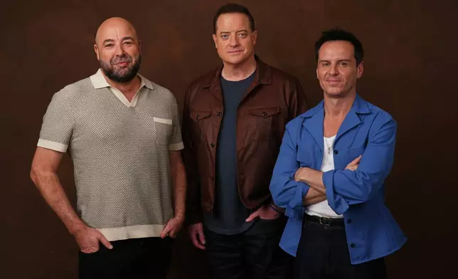 Anthony Maras, left, director/co-writer of the film "Pressure," poses with cast members Brendan Fraser, center, and Andrew Scott on Tuesday, May 12, 2026, in Los Angeles. (AP Photo/Chris Pizzello)