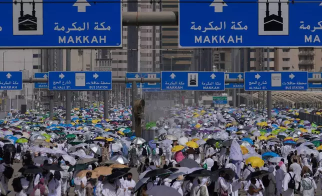 Muslim pilgrims leave after casting pebbles at pillars in the symbolic stoning of the devil, the last rite of the annual Hajj, in Mina near the holy city of Mecca, Saudi Arabia, Wednesday, May 27, 2026. (AP Photo/Altaf Qadri)