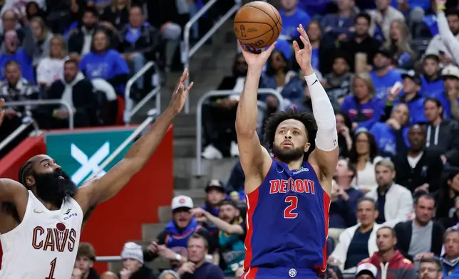 Detroit Pistons guard Cade Cunningham (2) takes a jump shot against Cleveland Cavaliers guard James Harden (1) during the first half in Game 5 of a second-round NBA playoffs basketball series, Wednesday, May 13, 2026, in Detroit. (AP Photo/Duane Burleson)