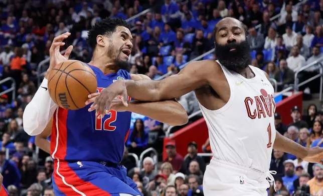 Cleveland Cavaliers guard James Harden (1) knocks the ball out of the hands of Detroit Pistons forward Tobias Harris (12) while going to the basket during the first half in Game 5 of a second-round NBA playoffs basketball series Wednesday, May 13, 2026, in Detroit. (AP Photo/Duane Burleson)