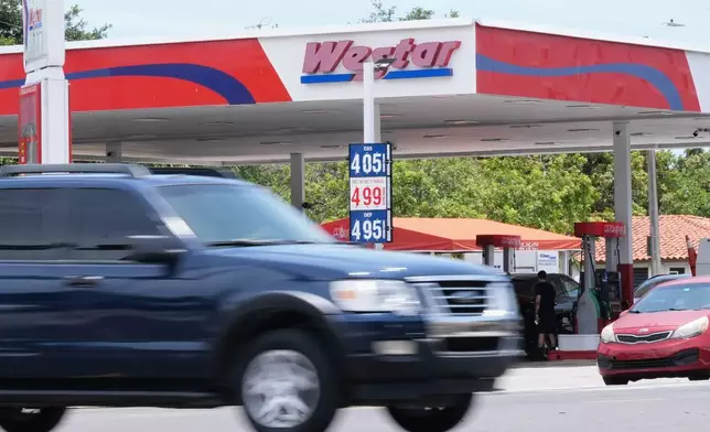 Gas prices are displayed at a Westar gas station in Miami, Tuesday, May 12, 2026. (AP Photo/Marta Lavandier)