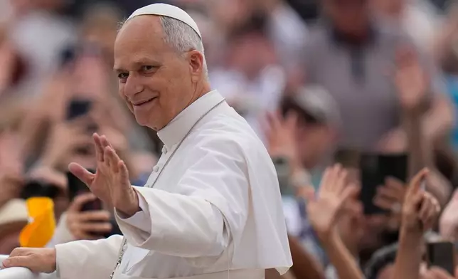Pope Leo XIV arrives for his weekly general audience in St. Peter's Square, at the Vatican, Wednesday, May 13, 2026. (AP Photo/Alessandra Tarantino)
