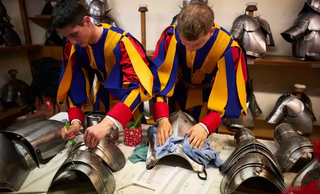 Pontifical Swiss Guards prepare ahead of their swearing in ceremony, at the Vatican, Wednesday, May 6, 2026. (AP Photo/Andrew Medichini)