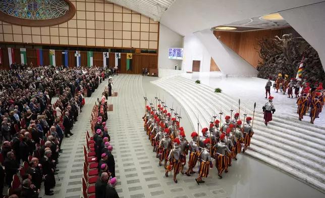 New Pontifical Swiss Guards attend a swearing-in ceremony in the Paul VI Hall at the Vatican, Wednesday, May 6, 2026. (AP Photo/Andrew Medichini)